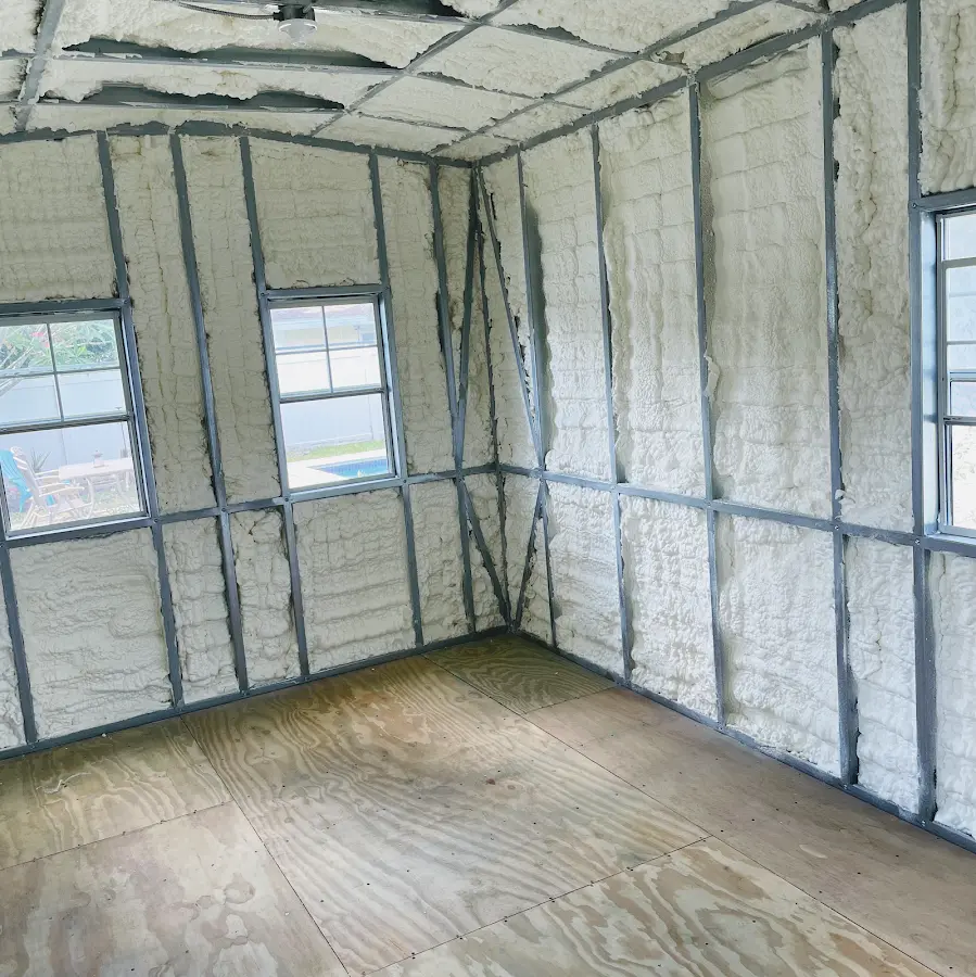 Closed-cell spray foam insulation applied to wall cavities in a residential project in Wayne